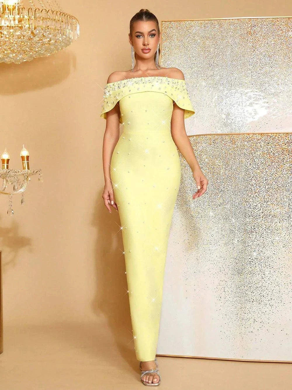 Vestido bodycon longo com ombros descobertos e pérolas, ideal para festa ou noite
