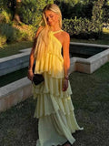 Vestido amarelo longo feminino com decote halter sexy e folhos florais, ideal para praia e festa de verão